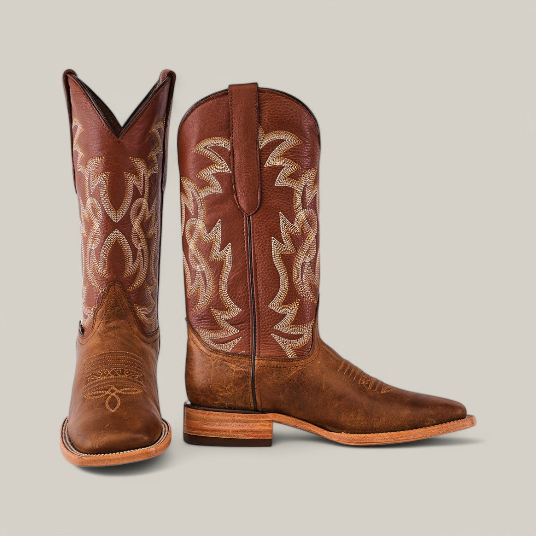 The Siberia Honey - Square Toe boots are crafted from premium brown leather with intricate beige stitching on the shaft. They feature a slightly pointed toe and a low stacked heel against a plain beige background.