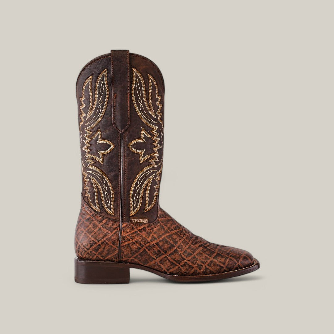 Mamut Grimm Brown - Square Toe boots showcase intricate tan stitching and patterns on the shaft and foot. Made from premium leather, they feature a low heel, pull tabs on the sides, and a neutral beige background.