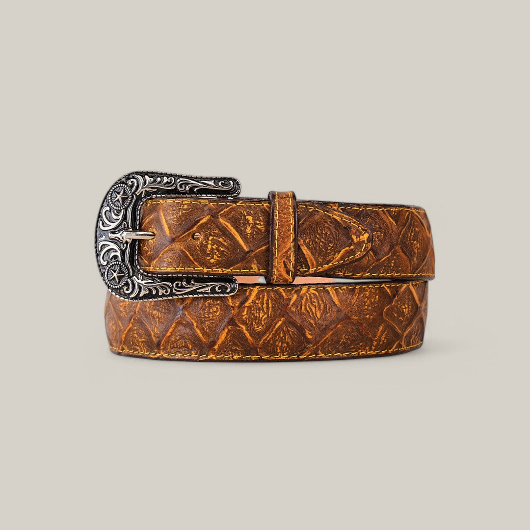 The Pirarucu Print Honey - Texas Buckle, a textured brown leather belt with an intricately designed decorative buckle, serves as a stunning statement piece against a plain light gray background.