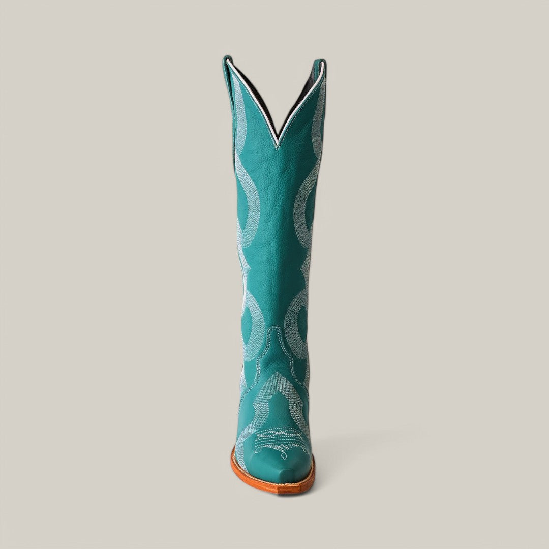 The Olimpia Green Teel boot, crafted from premium materials, features intricate white stitching, a snip toe, and a wooden heel. This tall shaft cowboy boot stands proudly against a plain light background, showcasing its artistry and meticulous attention to detail.