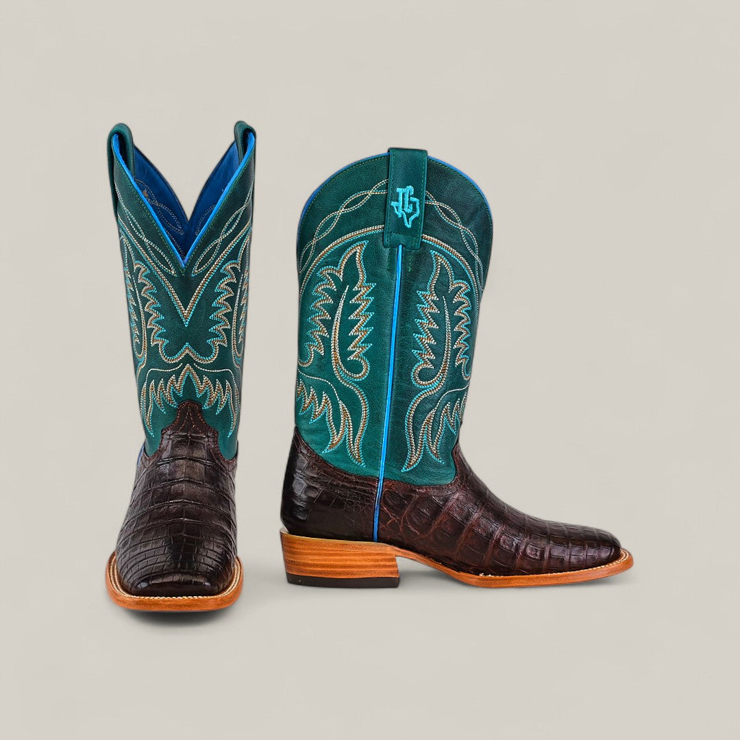 The Exotic Caiman Horn Back - Dark Brown - Square Toe boots feature brown caiman-textured leather, teal shafts with yellow stitching, blue trim, wooden heels, and side logo from the Platinum Collection.