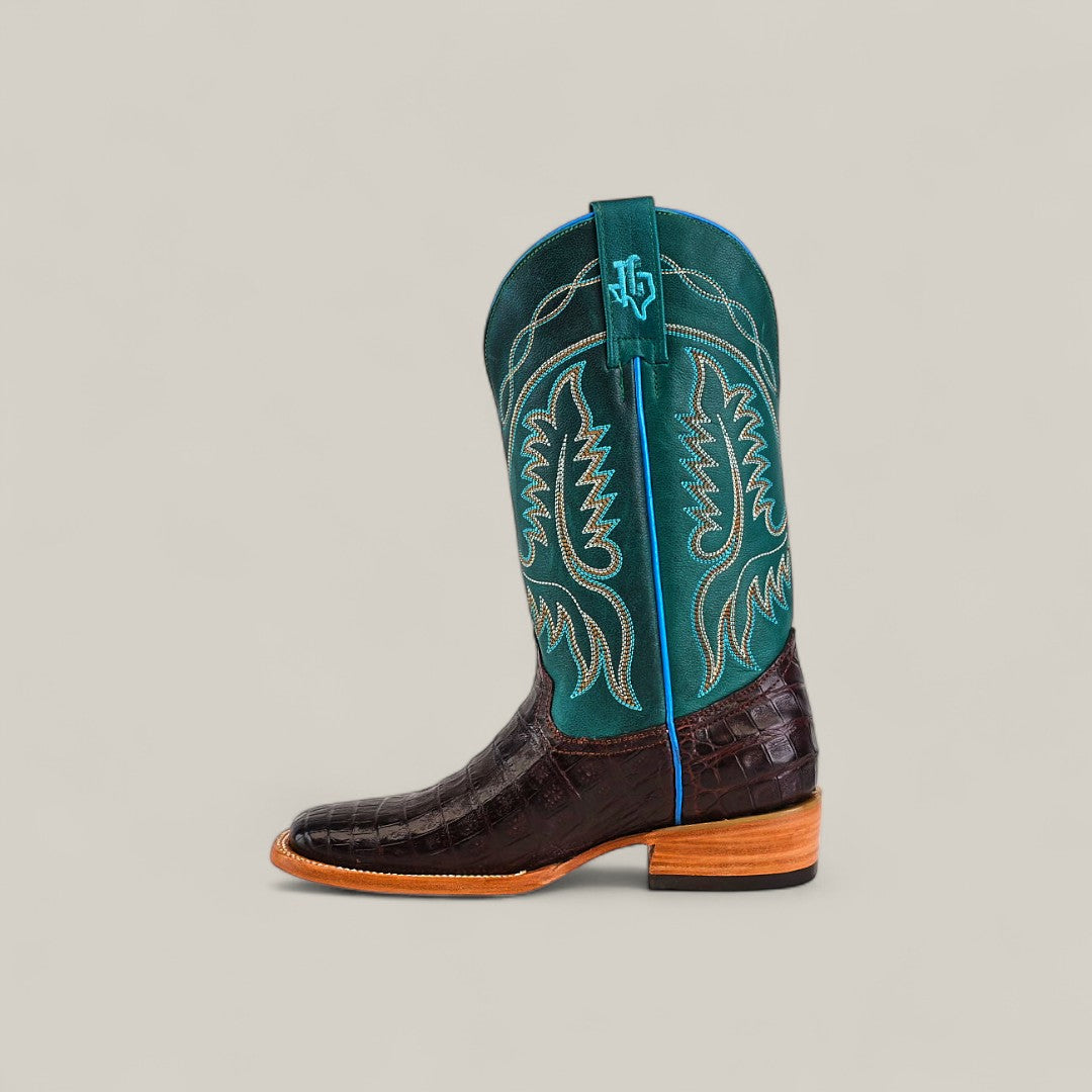 The Exotic Caiman Horn Back - Dark Brown - Square Toe boot showcases a textured dark brown foot, tall teal shaft with decorative stitching, blue pull tab, light brown sole, and low heel for a standout Platinum Collection look.