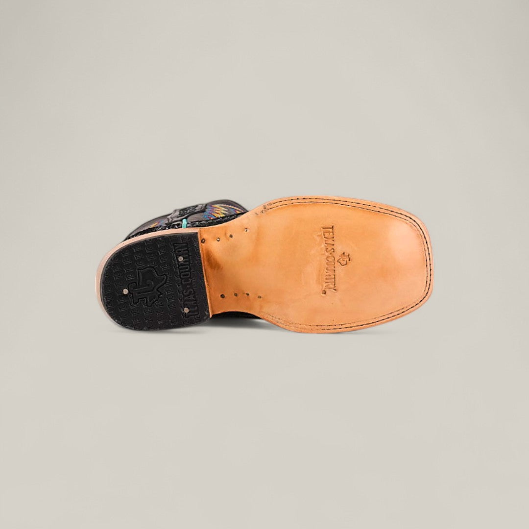 A single Exotic Python Black - Square Toe kids boot is shown sole-up on a plain background, displaying a tan leather sole with stitched edges, black rubber heel, and Double H branding near the arch.