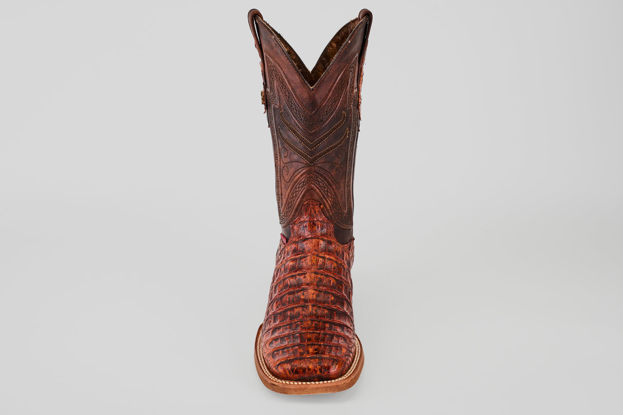 The Exotic Caiman Horn Back - Smoke Cogñac- Square Toe boot features textured caiman leather with decorative stitching, shown from the front against a plain light gray background.