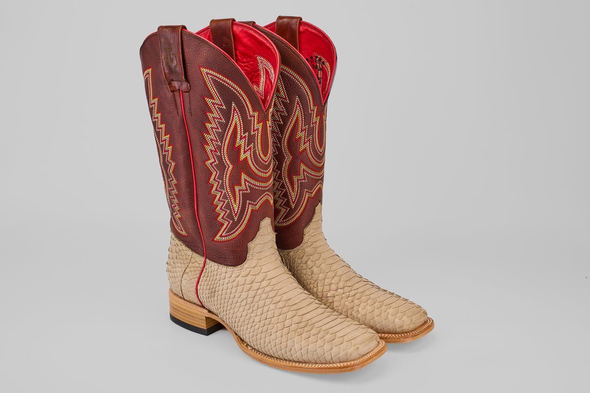 The Braxton - Cappucino - Square Toe is a luxury mens boot with beige textured python leather foot, light brown soles, tall dark red shafts adorned with gold and red stitching, and a vibrant red interior lining.
