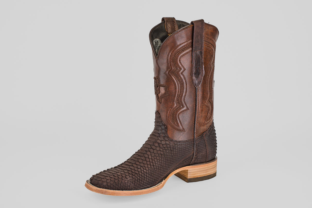 A single Tanner - Matte Brown - Square Toe cowboy boot features a matte brown finish, scale-textured foot, smooth shaft with decorative stitching, and a wooden heel, displayed on a plain white background.
