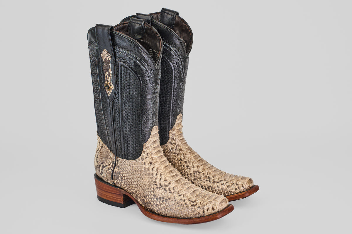 Tanner - Natural - Narrow Square Toe cowboy boots with black shafts and tan, snakeskin-patterned vamps, featuring brown wooden heels, shown on a plain light background.