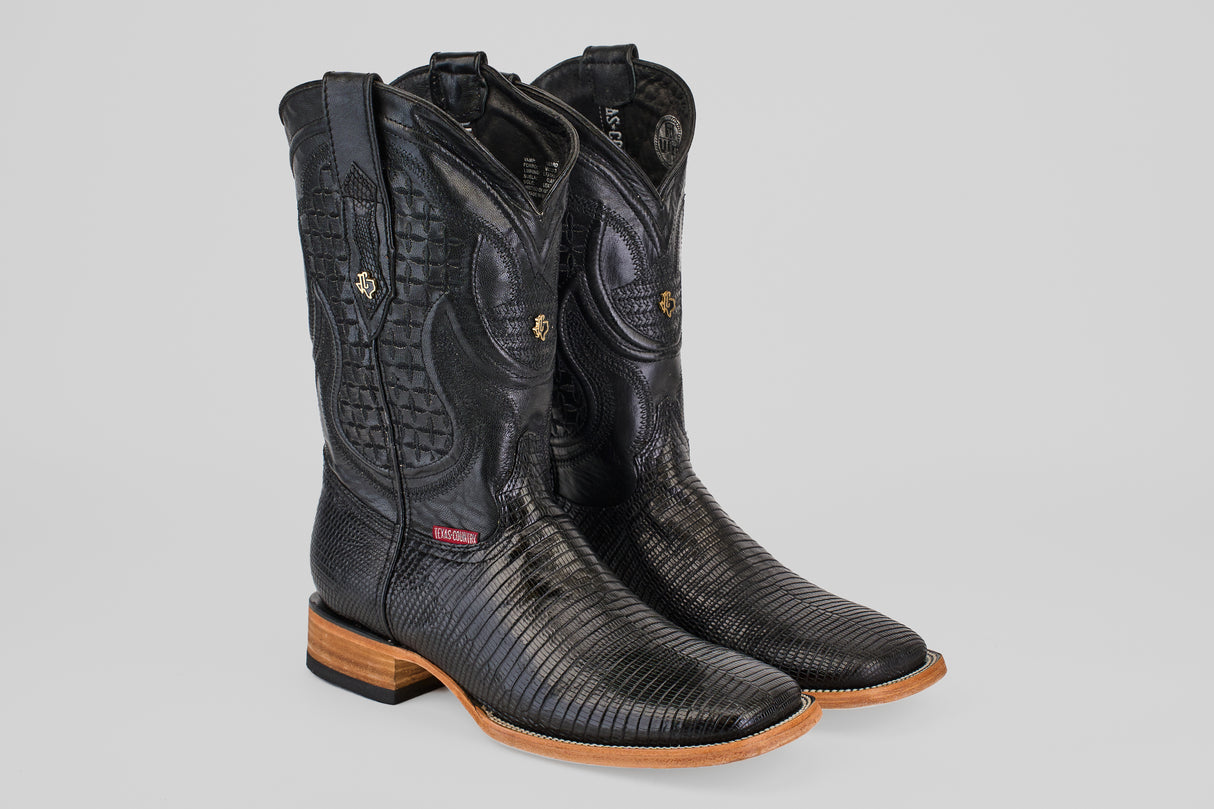 The Blaze – Black – Square Toe cowboy boots, made from genuine lizard leather with decorative stitching, wooden heels, and tan soles, are showcased against a light gray background.