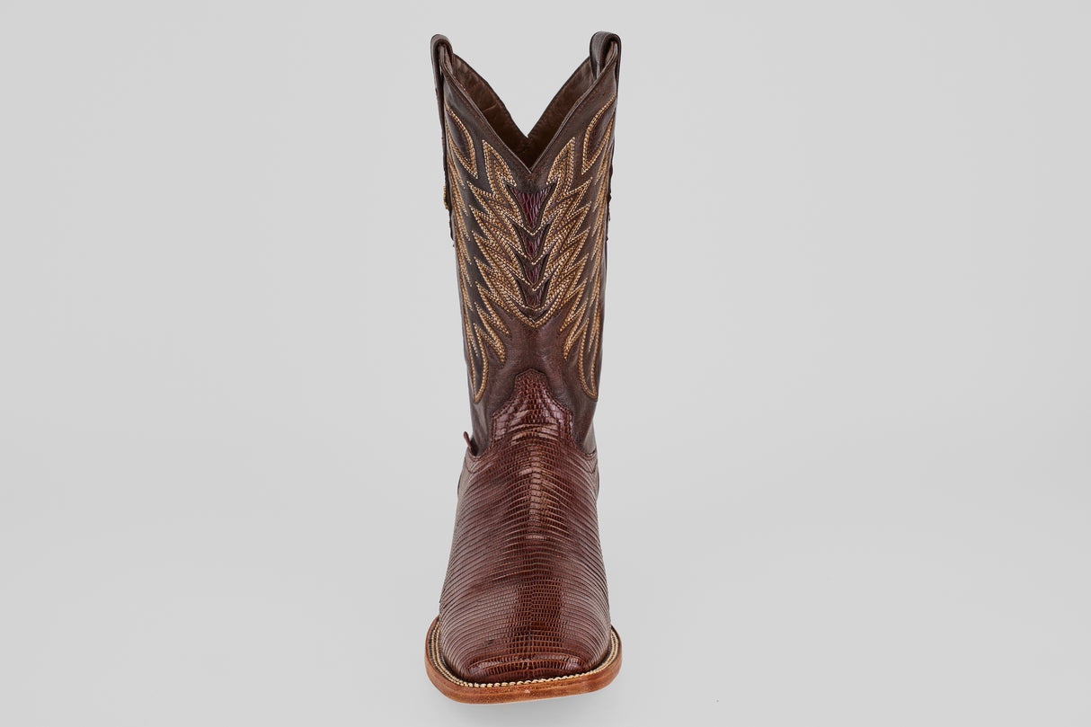 A single Blaze – Brown – Square Toe boot is displayed facing forward on a plain light gray background, highlighting its classic western design and decorative stitching.