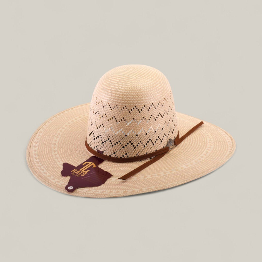 The 30X Zig Zag - Open Crown is a light tan woven straw cowboy hat with unique zig zag cut-out patterns, a brown band, metallic emblem, and Texas A&M University tag—perfect for fans of distinctive hat styles.