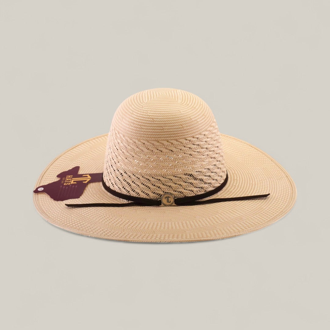 The 30X Worm - Open Crown is a wide-brimmed, woven straw hat with an open crown, brown band, front emblem, and an Arizona-shaped maroon tag, shown against a plain beige background.