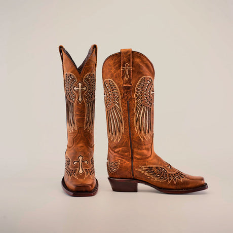 A pair of brown cowboy boots with intricate embroidery featuring wings and crosses, set against a plain background.