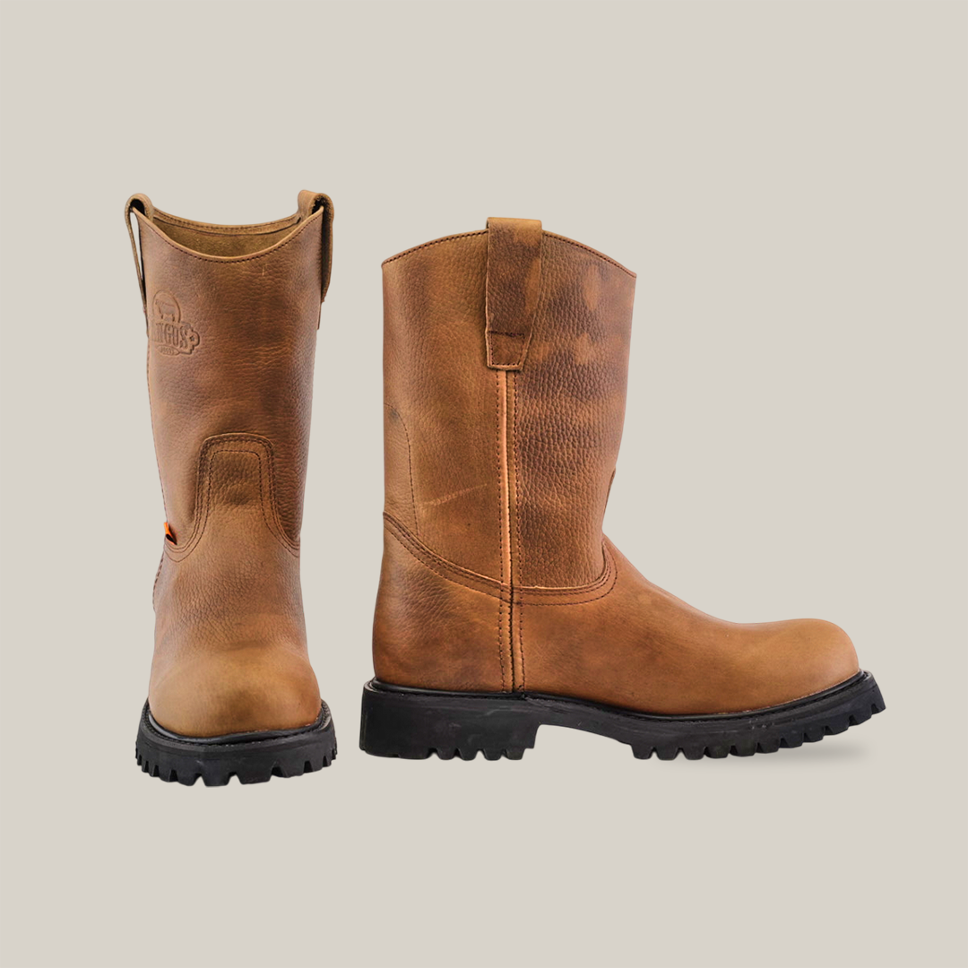 The Tan Roper - Tractor Sole - Composite Toe boots, made from premium cowhide leather, are displayed on a white background. One boot is upright, showing the side view, while the other reveals the back, each featuring rugged black soles and pull tabs for strong traction.