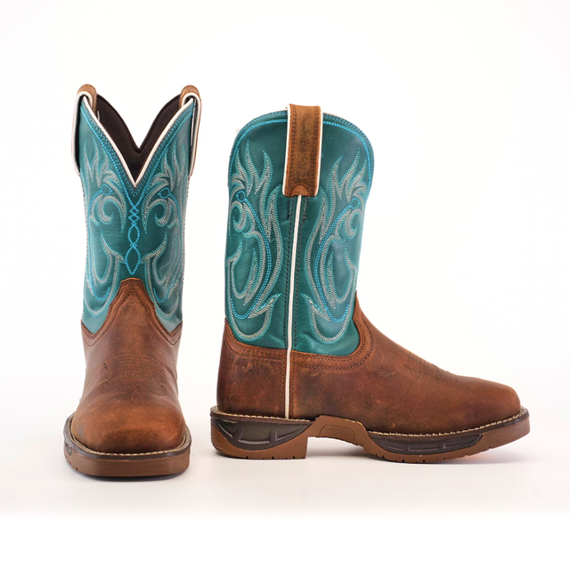 The Rustic Turquoise Brown boots are handcrafted with brown premium cowhide leather foot, a turquoise shaft, and intricate white stitching. One boot faces forward while the other side highlights the pull tab and exquisite design.