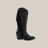 Introducing the Praga Fringe Tall Shaft Black - J Toe from the Platinum Collection. This black cowboy boot boasts high-quality leather, fringe detailing, gleaming studs, a chunky medium-height heel, and a stylish pointed toe against a pristine white backdrop.