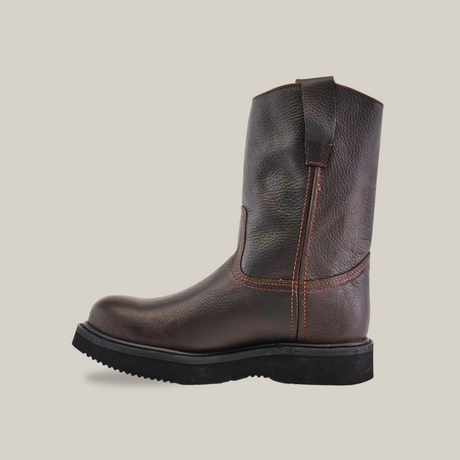 The Brown Roper - Laredo Sole - Composite Toe is a side-view dark brown leather boot made from premium cowhide, featuring a smooth finish, visible stitches, and a pull loop at the top. It rests on a chunky Brown Roper Laredo Sole.