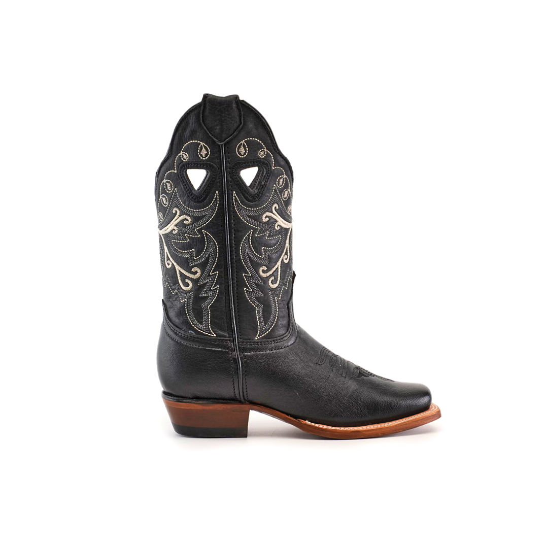 The Western Stitch Black Lustre boot features a narrow square toe, premium black leather, white Western stitch designs, decorative shaft cutouts, a brown sole, and low heel to showcase traditional craftsmanship.