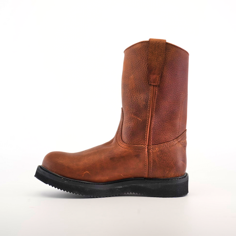 The Brandy Roper Laredo Sole brown leather pull-on work boot, shown from the side against a white backdrop, highlights its Western bootmaking roots with a rugged texture and black sole. Pull straps adorn the top for easy wearing.