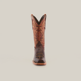 The Fresno Chocolate - Wide Cutter Toe cowboy boot, crafted from premium cowhide, showcases intricate stitching on a white background. It features a pointed toe, high shaft with decorative patterns and pull straps, blending dark brown and earthy tones in its design.