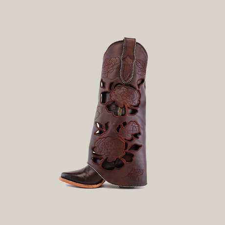 The Platinum Collections Roma Flowers Tall Shaft Chocolate boot stands upright with a J toe shape, slight heel, and intricate stitching.