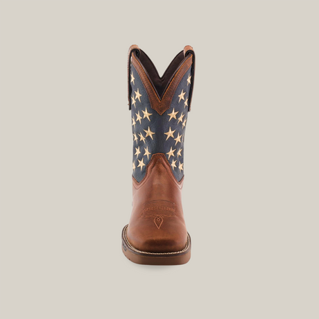 A single Navy Brown US Flag Waterproof - Composite Toe cowboy boot crafted from premium cowhide leather features a brown foot and a blue shaft with white stars. The boot is centered against a plain white background, highlighting its rugged construction.