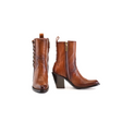 Introducing the Francia Rings Bootie Tan - J Toe from our Platinum Collection: stylish brown leather ankle boots featuring side zippers, decorative back lacing, a block heel, and rounded toe on a white background.