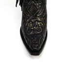 Black leather boot with intricate gold embroidery on a white background