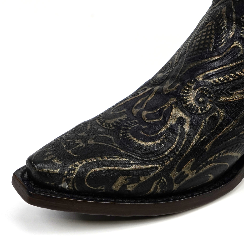Black cowboy boot with intricate gold embroidery on a white background