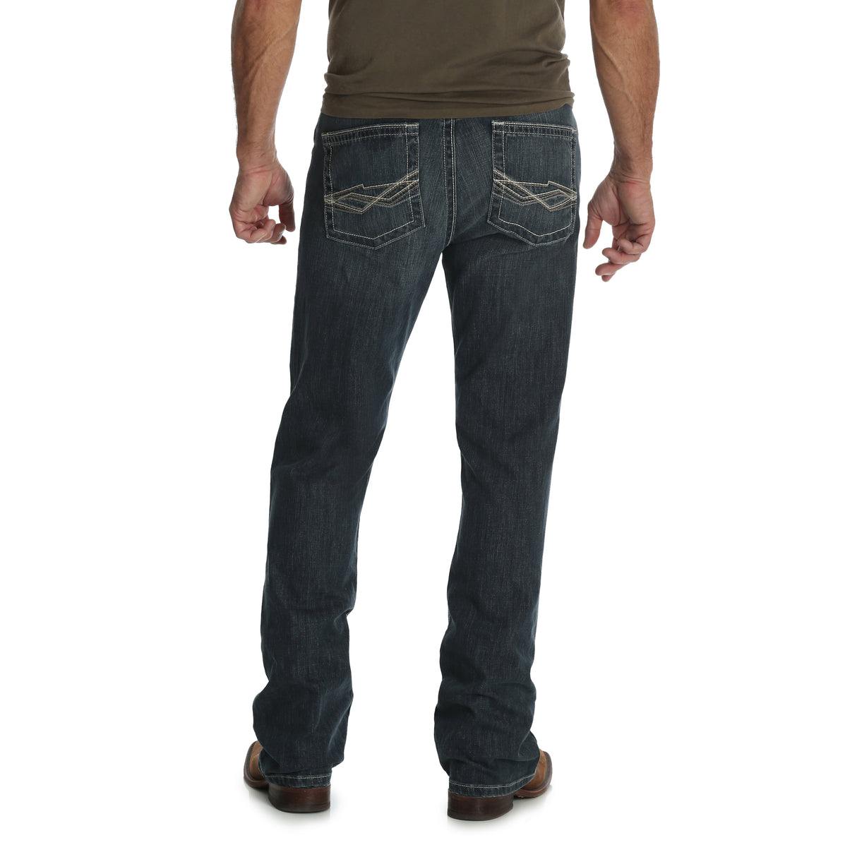 Back view of a person in Mens Wrangler 20X No. 42 Vintage Bootcut Jeans—42MWXGG, dark blue with decorative back pocket stitching. Paired with a dark t-shirt and brown shoes against a white background, they confidently showcase the premium denims timeless style.