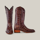 A pair of brown Exotic Full American Alligator - Round Toe boots, with wooden soles. One boot stands upright forward; the other is sideways, highlighting the rich texture and pattern of the leather against a light gray background.