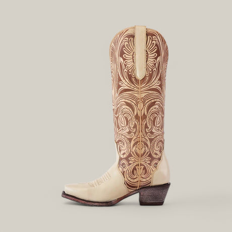 The Cavalier Laser Cream boot, with a tall shaft and snip toe, showcases intricate embroidery in tan.