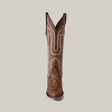 The Athala Exotic Python Tamarindo boot, with a tall shaft and snip toe, stands upright on a plain light gray background. Made of premium brown python leather, it showcases intricate stitching and detailed decorative designs that embody Western heritage.