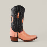 The Exotic Python Pink - Short Shaft - Snip Toe boot blends a pink python pattern on the lower section with black leather featuring orange embroidery on the upper. It includes a pointed toe and short heel, adorned with ornate details, against a plain gray backdrop.