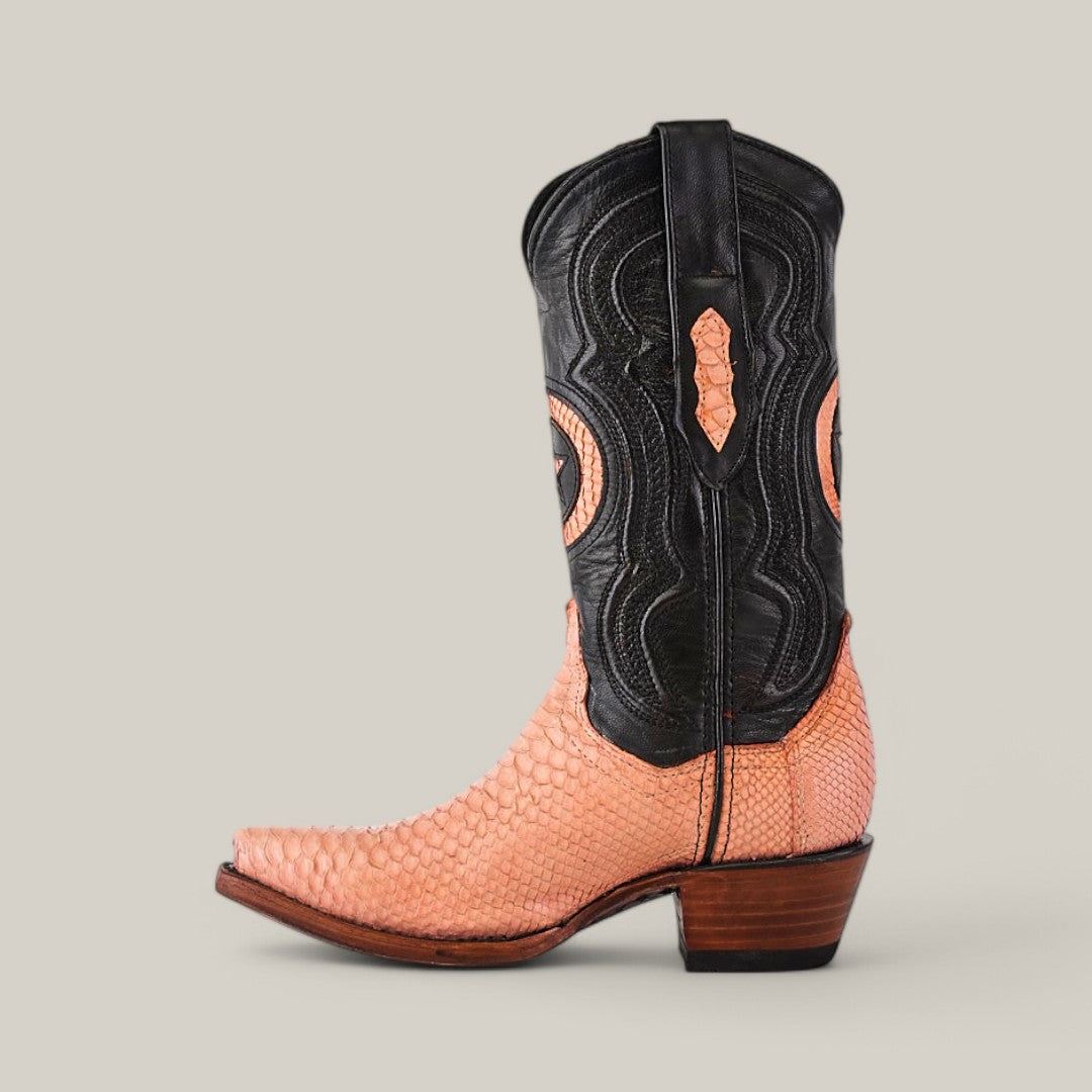 The Exotic Python Pink boot offers an exotic python leather texture in vibrant orange on the foot, a sleek black leather upper with intricate stitching, and features a pointed toe and wooden heel for a striking design against a plain background.