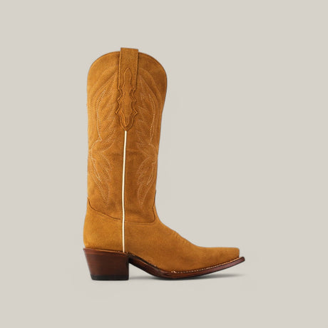 The Miranda Suede Gold Leather Sole boot, featuring a tan suede finish and intricate stitching, is shown against a light gray background. Its pointed toe and mid-height wooden heel complement the gold sole, while a pull strap enhances the charm of this mid shaft design.