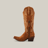 A Kellie Suede Caramel Leather Sole cowboy boot with decorative white stitching and side zipper is shown against a beige background. This tall-shaft, snip-toe boot with a chunky heel exudes rustic charm and elegance.