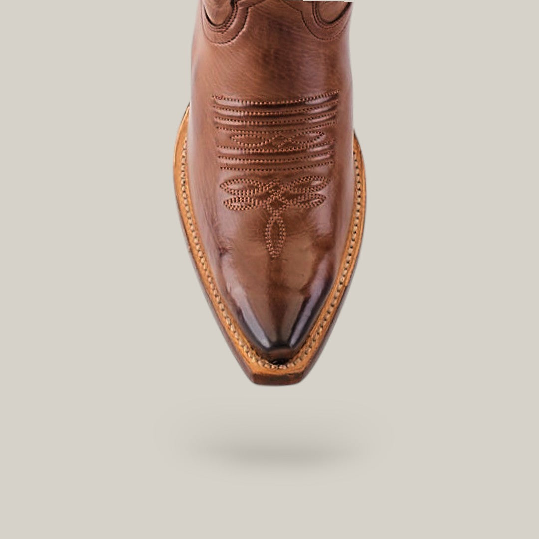 Showcasing Western elegance, the Kellie Clayton Brown Leather Sole boot features intricate stitching patterns on its snip toe, presented from a top view against a plain light gray background.