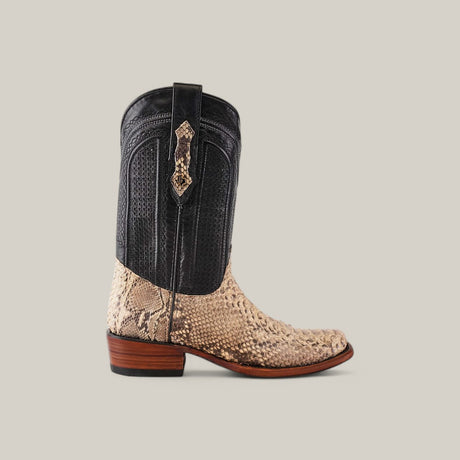 The Exotic Python - Natural - Narrow Square Toe cowboy boot features a striking black leather upper contrasting with a light tan exotic python leather lower, finished with a wooden heel. Its unique textures stand out against the plain light gray background.