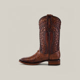 The Exotic American Alligator - Herradura - Fawn boot offers a luxurious feel with intricate leather patterns and detailed stitching. Featuring a square toe, short heel, and pull tab, this Western footwear design echoes the style of alligator boots.