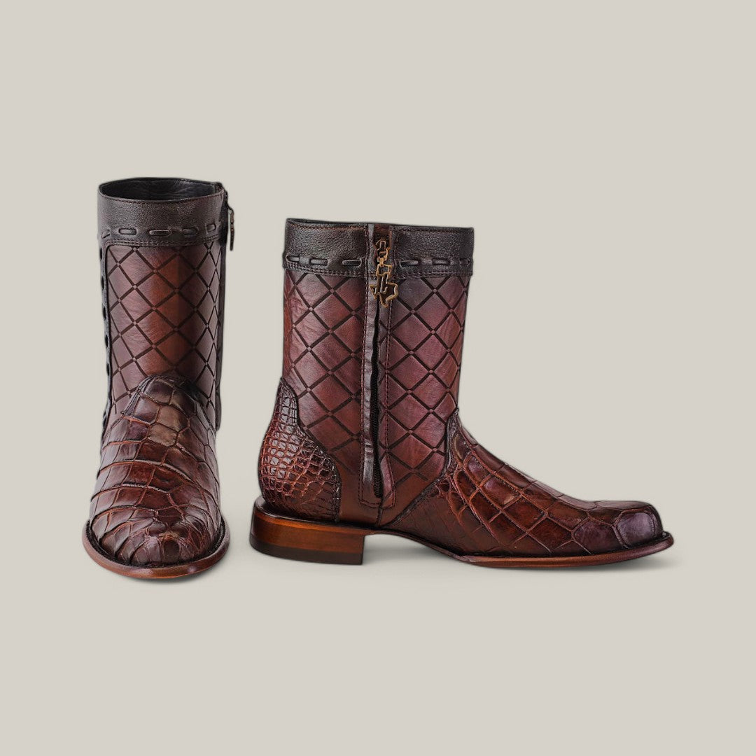 A pair of handcrafted Exotic American Alligator - Europe Brown boots with a unique alligator skin pattern and zipper details, showcasing a dark brown upper, square toe, and low wooden heel, displayed side by side on a light gray background.