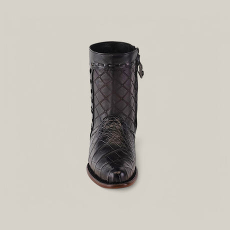 The Exotic American Alligator boot in Europe Black features a quilted texture and detailed stitching with a side zipper and decorative metal accents. This European design showcases a round toe and low heel, set against a plain grey background.