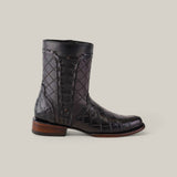 The Exotic American Alligator - Europe Black Round Toe boot, a dark brown leather design with a low heel, boasts a crocodile-like texture and quilted shaft detailing. Showcasing European design sensibilities, it looks polished against a plain light gray background.