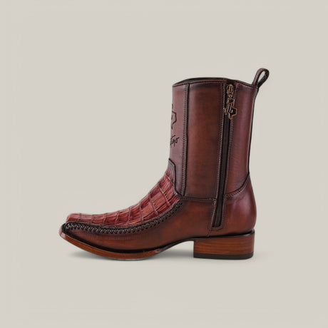 The Exotic Caiman Brandy boot, made from high-quality caiman leather, boasts a unique crocodile texture and side embroidery. Designed with a narrow square toe, it offers a convenient side zipper and a sturdy, slightly elevated wooden heel for effortless western style.