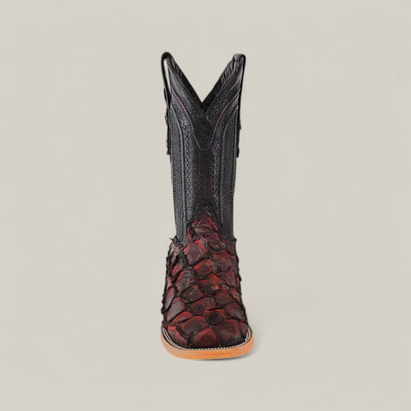 Front view of the Exotic Pirarucu Fish - Red boot featuring dark red and black fish scales, intricate stitching on the upper shaft, a tan sole, and a square toe for those seeking unique style.