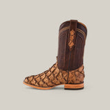 An Exotic Pirarucu Fish Matte Orix Square Toe cowboy boot featuring dark brown exotic leather with a tan lower section, intricate stitching, and textured design stands against a light gray background. It highlights a wooden heel.