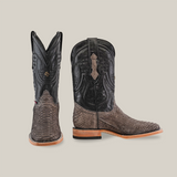 A pair of striking Exotic Python - Matte Gray, square-toe cowboy boots featuring black leather shafts and brown python vamps. The left boot is front-facing, while the right boot shows a side view against a light beige backdrop.