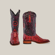 The Exotic Python - Ruby boots are crafted from ruby-toned python leather with intricate stitching. These boots feature square toes and wooden heels, displayed by one boot standing upright and the other in a side view.