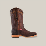 The Exotic Python - Matte Brown - Square Toe is a singular cowboy boot made from textured matte brown leather, featuring intricate stitching, a flat wooden sole, a square toe, a pull tab at the top, and a small decorative emblem on the side.