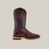 Displayed on a plain background is the Exotic Caiman Horn Back - Black Cherry - Square Toe cowboy boot, crafted from high-quality caiman leather. It features intricate patterns, a flat wooden heel, decorative details on the shaft, and boasts an exotic yet refined look with its slightly pointed toe.