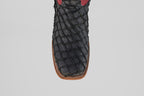 A top view close-up of the Dodge - Matte Black - Square Toe boot showcases its textured Pirarucu leather, square toe design, and brown stitching along the sole—an exemplar of mens luxury boots.